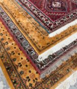 GROUP OF FIVE RUGS, including a large 'Qashqai' rug with stepped madder field on blue ground, animal