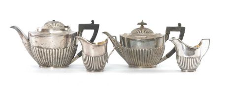 ASSORTED SILVER TEAWARE including two teapots and two milk jugs with similarly half-fluted oval