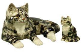 WINSTANLEY CATS, recumbent tabby cat No. 7, 19cms (h); and seated tabby kitten No. 1, 13.5cms (h)