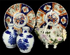 TWO CIRCULAR IMARI SCALLOPED CHARGERS, 29cms (diam.); a pair of blue and white baluster vases, 18cms