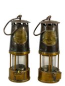 TWO PROTECTOR LAMP & LIGHTING CO. TYPE 6 MINER'S LAMPS, brass and steel, with suspension loops,