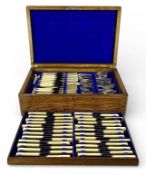 VINTAGE OAK-CASED CANTEEN OF CUTLERY, two lift-out drawers fitted with knives and forks, approx.