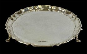 GEORGE V CIRCULAR SILVER WAITER, moulded rim, on three pad feet, W&Co(S) Ltd, Sheffield 1937,