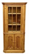 MODERN PINE FLOOR STANDING CORNER CUPBOARD, curved back, glazed single door top and two cupboard