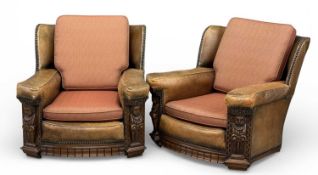 PAIR OF EDWARDIAN CLUB-TYPE ARMCHAIRS, with carved figures to the front, studded leather upholstery,
