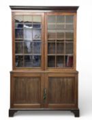 VICTORIAN MAHOGANY BOOKCASE CUPBOARD, glazed top doors with adjustable shelves, above the base