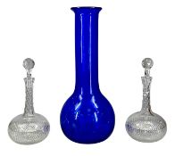 ART GLASS COBALT BLUE TALL VASE, 48cms (h), and a pair of circular cut glass decanters with