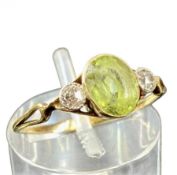 GOLD RING, central oval citrine flanked by two small diamonds, size M, 1.6g Provenance: deceased