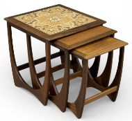 G PLAN MID-CENTURY TYPE TEAK NEST OF THREE TABLES, largest with tile top, 51 (h) x 50cms² (3)