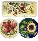 THREE MOORCROFT PIN TRAYS, circular 'Magnolia', 12cms (diam.), circular 'Albany', 12cms (diam.), and