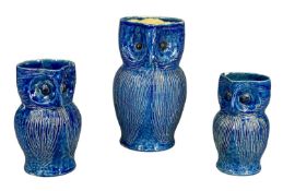 FARNHAM POTTERY OWL JUGS, graduated set of three, blue mottled glaze, 20 to 13.5cms (h)