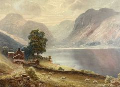THOMAS FINCHETT (1858-1931) oil on canvas - mountainous lake with sheep in foreground, farmhouse