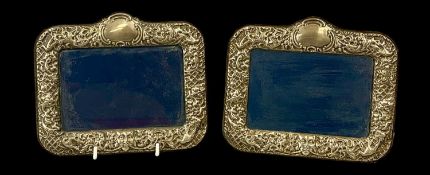 PAIR OF SILVER MOUNTED PHOTOGRAPH FRAMES, ornate repoussé decoration and plush backing, 14 x 17cms