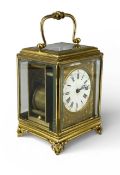 GILT BRASS-CASED FOUR-GLASS CARRIAGE CLOCK, circular white enamel dial with Roman numerals, 13cms (