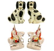 19TH CENTURY STAFFORDSHIRE, a large pair of seated cream and black spaniels with gilt collars and