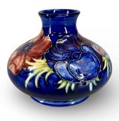 MOORCROFT BLUE ANEMONE SQUAT VASE, impressed marks and Queen Mary label to base, 11cms (h)