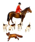 BESWICK HUNTING GROUP, comprising huntsman in red coat on bay horse, four hounds, and standing fox