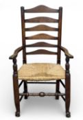ANTIQUE OAK RUSH-SEATED LADDER-BACK CHAIR, on hoof supports, 110 (h) x 63 (w) x 42cms (d)