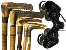 FOUR VINTAGE RIDING CROPS with antler handles, an antler handled walking stick, and a pair of