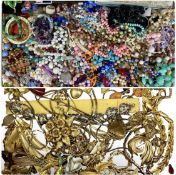 LARGE ASSORTMENT OF COSTUME JEWELLERY, including gold-toned brooches, necklaces, various bead