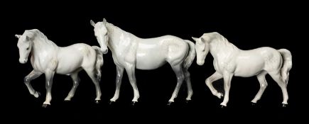 THREE DAPPLE GREY BESWICK HORSES largest approx. 17cms (h), other two approx. 14.5cms (h) (3)