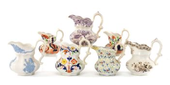 SEVEN SWANSEA CAMBRIAN POTTERY POUCH JUGS, patterns including 'Oriental Basket', flower sprigged,