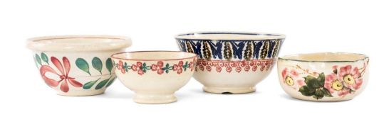 FOUR LLANELLY POTTERY BOWLS, comprising a painted Wild Rose bowl by Arthur Shufflebotham with wavy