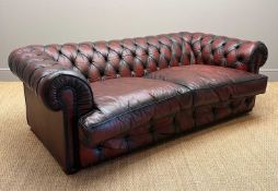 'ADMIRAL' OXBLOOD THREE-SEATER CHESTERFIELD SOFA, 70 (h) x 215 (w) x 125cms (d) Provenance: