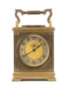 FRENCH GILT BRASS MANTEL CLOCK, in the form of a carriage timepiece, visible escapement, Arabic