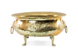 DUTCH BRASS OVAL WINE COOLER having fleuer-de-lys and flowering urn engraved body, loose ring mask