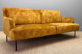 CONTEMPORARY THREE-SEATER SOFA, mustard 'velvet' upholstery, raised on five slender metal legs,