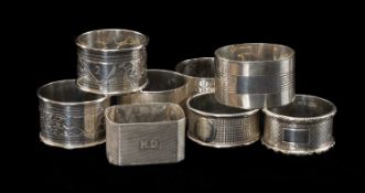 ASSORTED SILVER NAPKIN RINGS, engraved and engine turned decoration, two numbered, three