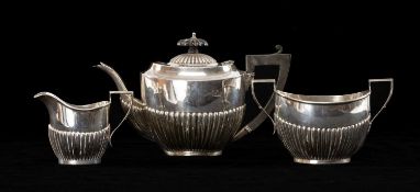 GEORGE V SILVER THREE-PIECE TEA SERVICE, Birmingham 1916, oval half fluted form, approx. wt. 13.5ozt