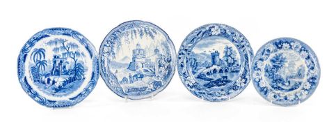 FOUR CAMBRIAN BLUE PRINTED POTTERY PLATES, patterns comprising 'Cows Crossing the Stream', '