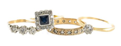 FOUR GEM-SET RINGS, including a diamond solitaire ring, the old round-cut diamond approx. 0.2cts,