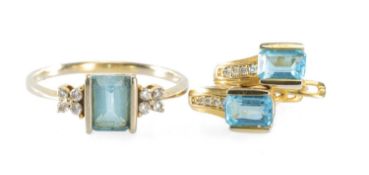 BLUE TOPAZ & DIAMOND SUITE, comprising a light blue emerald-cut topaz ring, bordered with eight