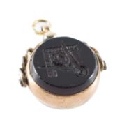 9CT GOLD MASONIC SWIVEL FOB, inset with black onyx intaglio, 30mms, gross weight 8.3g Provenance: