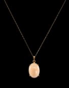 14CT GOLD PINK CORAL PENDANT, oval, 17 x 13mm on slender 14ct chain, 4.3g Provenance: private