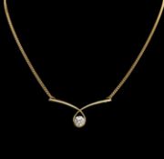 DIAMOND PENDANT NECKLACE by David M. Robinson, the crossover pendant centred with a brilliant-cut