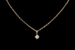 CUBIC ZIRCONIA PENDANT in unmarked yellow metal, suspended from a 9ct gold fine belcher chain