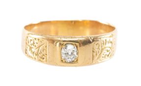 YELLOW METAL DIAMOND RING, the single old-cut stone measuring 0.25cts approx., flanked by engraved