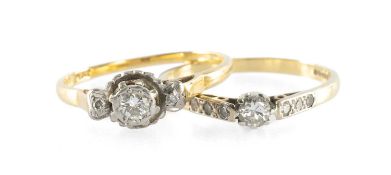 DIAMOND THREE-STONE RING, the central round brilliant-cut stone approx. 0.2cts, bordered with tiny