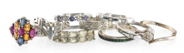 SMALL ASSORTMENT OF SILVER DRESS RINGS, some gem set, various sizes, including one cut (9), gross