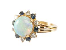 18K GOLD OPAL, DIAMOND & SAPPHIRE RING, the round cabochon opal approx. 10mm (diam.), within a