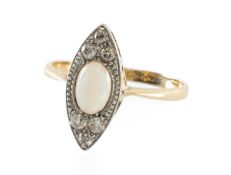 OPAL & DIAMOND CLUSTER RING in 18ct gold and platinum, the central cabochon opal flanked with six