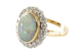 18CT GOLD OPAL & DIAMOND RING, the large single oval opal surrounded by 18 diamonds, 18 x 16mm,