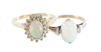 OPAL & DIAMOND CLUSTER RING in 9ct gold, the opal approx. 7 x 5mms, bordered with tiny brilliants,