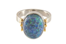 WHITE & YELLOW METAL RING set with large oval opal, 14 x 10mm, size P Provenance: private collection