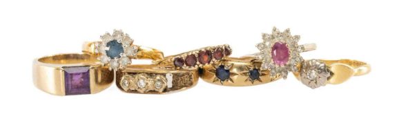 SEVEN YELLOW METAL GEM-SET RINGS comprising five 9ct gold rings variously set with amethyst, diamond
