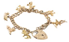 9CT GOLD CURB-LINK CHARM BRACELET with engraved padlock clasp and safety chain, supporting seven